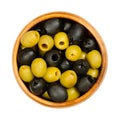 Pitted green and black olives, Hojiblanca, Spanish table olives in a bowl Royalty Free Stock Photo