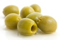 Pitted green olives with brine. Royalty Free Stock Photo