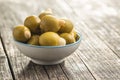 Pitted green olives stuffed with almonds in bowl