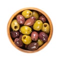 Pitted Kalamata and green olives, mixed olives with herbs, in a wooden bowl Royalty Free Stock Photo