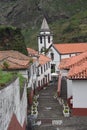 Pittoresque red roofed white village and church Royalty Free Stock Photo