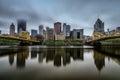 Pittsburgh, Pennsylvania - May 13, 2018 : Reflections of the Pittsburgh skyline in the Allegheny River on a cloudy, foggy day