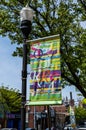 Pittsburgh, Pennsylvania, USA April 27, 2023 A colorful Squirrel Hill sign on a lamp pole on Forbes Avenue Royalty Free Stock Photo