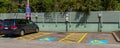 Pittsburgh, Pennsylvania, USA April 27, 2023 Three handicapped parking spaces, one with a van occupying it in a parking lot Royalty Free Stock Photo