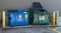 Pittsburgh, Pennsylvania, USA April 27, 2023 Two large garbage dumpsters in a parking lot in the Squirrel Hill neighborhood
