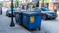 Pittsburgh, Pennsylvania, USA July 1, 2022 Three metal garbage dumpsters placed on the curb on Murray Avenue