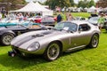 An antique silver Jaguar coupe