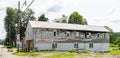 Pittsfield, Pennsylvania, USA August 1, 2023 An old, fire damaged building that was once a laundromat and how houses an apartment