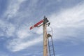 Pivoted arm railway semaphore signal with spectacle and coloured lenses in a blue sky Royalty Free Stock Photo