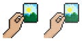 Pixel icon. Hand holds paper photograph. Memories of vacation or trip to nature. Printing photos. Simple retro game vector