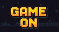 Pixelated \'GAME ON\' text with retro video game elements Royalty Free Stock Photo