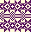 Pixelated ornament from a wool blanket. Purple and light yellow squares