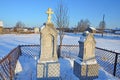 Piyala, Onega district, Arkhangelsk region, Russia, February, 14, 2018. Old graves of the priest with his wife near the Church of Royalty Free Stock Photo