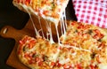 Slice of Homemade Pizza Alla Pala with Mouthwatering Stretching Cheese