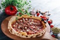 Pizza with anchois and garlic on wooden board Royalty Free Stock Photo