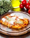 Pizza with artichoke and oregan on wood Royalty Free Stock Photo