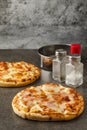 Pizza bacon Ham with a hot dog and cheese Mockup seasonings are salts, oregano, and paprika, front view and copy space for text Royalty Free Stock Photo