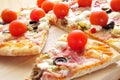 Pizza with bacon, olives, cherry tomatoes