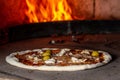 Pizza baking close up in the oven. Italian pizza is cooked in a wood-fired oven. Traditional baked wood fired oven Royalty Free Stock Photo