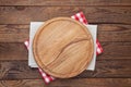 Pizza board, with tablecloth on wooden table. Top view mockup