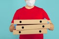 Pizza boxes for delivery. Man courier in gloves. Royalty Free Stock Photo