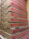 Pizza boxes stacked High in an Italian restaurant Brown cardboard box food delivery take out