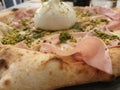 Pizza buffalo mozzarella pistachio mortadela dough Royalty Free Stock Photo
