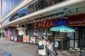 Pizza Cake on Las Vegas Blvd on the Vegas strip with people walking on the sidewalk