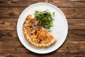 Pizza calzone with arugula and parmesan cheese Royalty Free Stock Photo