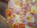 Pizza cheese ham and becon on wood table. Royalty Free Stock Photo