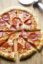 Pizza with cheese, pepperoni and salami. Meat feast pizza.