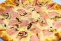 pizza with cheese, sausage and mushrooms. traditional Italian pastries. Royalty Free Stock Photo