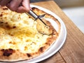 Pizza Chesse topping Hand cutting with pizza cutter