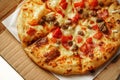 Pizza, close up photo of a delicious pizza with mozzarella cheese, onions, meat, tomato Royalty Free Stock Photo