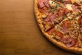 Pizza, composition: sauce, mozzarella cheese, pepperoni sausage, ham, bacon Royalty Free Stock Photo