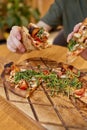 Pizza covered with roquette and shrimps close up. Royalty Free Stock Photo
