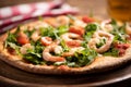 Pizza covered with roquette and shrimps Royalty Free Stock Photo