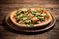 Pizza covered with roquette and shrimps Royalty Free Stock Photo