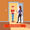 Pizza delivery boy handing pizza box to a girl Royalty Free Stock Photo