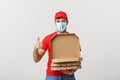 Pizza delivery concept. Young boy is delivering and showing pizza boxs in boxes. Isolated on white background Royalty Free Stock Photo