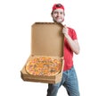 Pizza delivery concept. Young smiling guy is delivering tasty pizza.