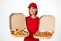 pizza delivery girl showing pizza inside boxes