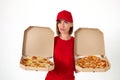 pizza delivery girl showing pizza inside boxes