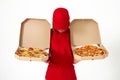 pizza delivery girl showing pizza inside boxes