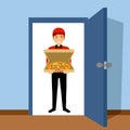 Pizza delivery man holding pizza box on doorway. Food online delivery service to customer home. Pizza boy bring order to buyer. Royalty Free Stock Photo