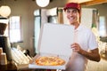 Pizza delivery man showing fresh pizza Royalty Free Stock Photo