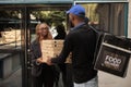 Pizza delivery to office, smiling customer holding boxes pile Royalty Free Stock Photo