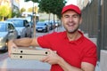 Pizza delivery worker in urban background