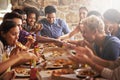 Pizza, dinner party and friends at a restaurant together feeling happy about social celebration. Diversity, food and Royalty Free Stock Photo