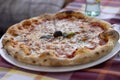 Pizza, dish of Italian origin usually consisting of a round pie with various toppings and melted cheese